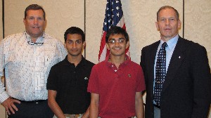 Joining together at the May luncheon are (l-r) Rick Stevens, chapter member; Neel Patel and Ashir Patel, University of Central Florida student chapter organizers; and Col. Wells Barlow, USA (Ret.), chapter vice president.
